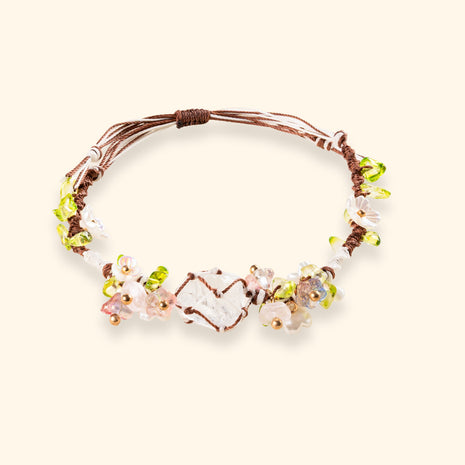 Daisy Chain — main view of clear quartz and braided cord bracelet with an open-heart centerpiece